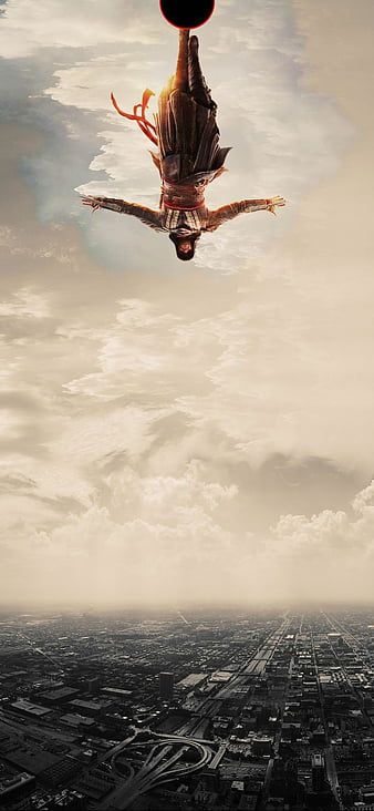 a person flying through the air above a city