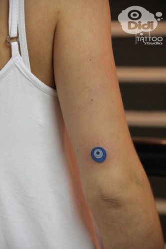 a person with a small tattoo on their arm