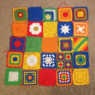 crocheted squares are arranged on the floor