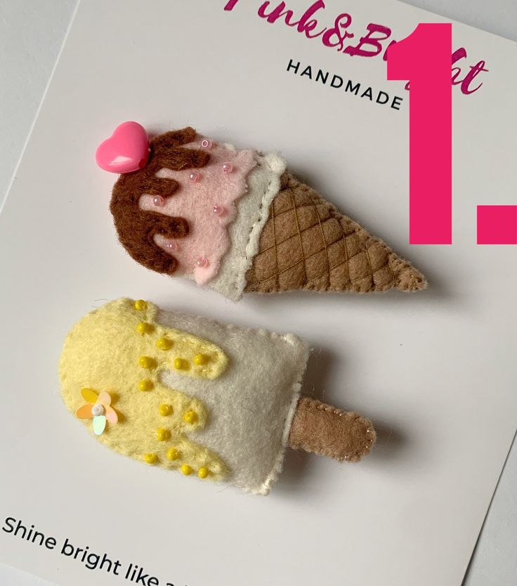 two miniature ice cream cones are on top of a card that says pink & blvd handmade