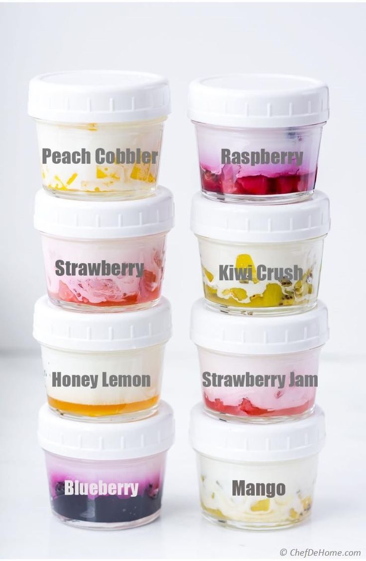 five different flavors of ice cream in plastic containers with the words strawberry, raspberry, kiwi crush and blueberry written on them