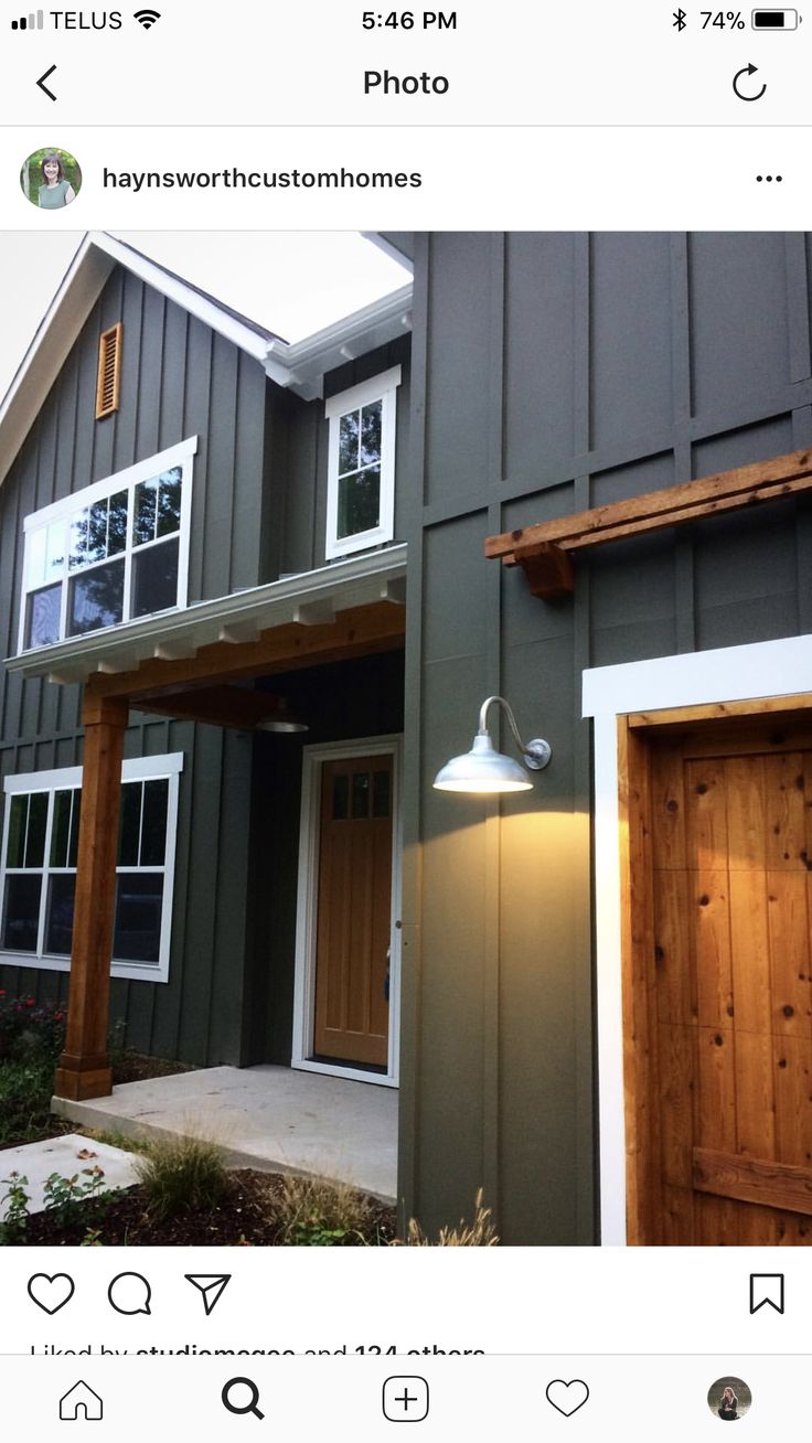 an instagramted photo of a house with wood doors