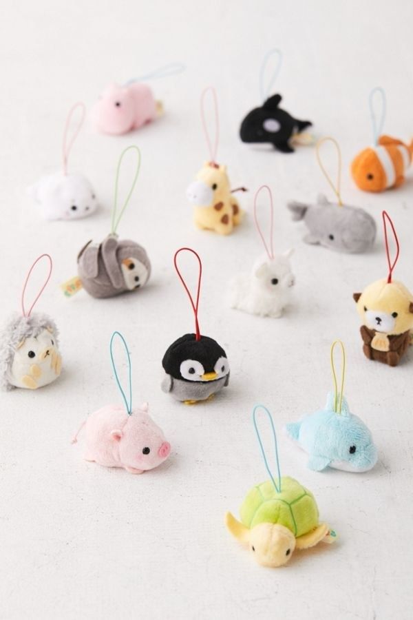 small animal ornaments are arranged on a white surface