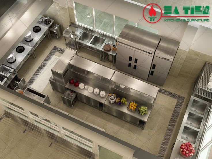 an overhead view of a commercial kitchen with stainless steel appliances and fruit on the counter