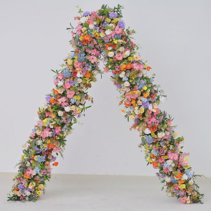 a very large letter made out of flowers