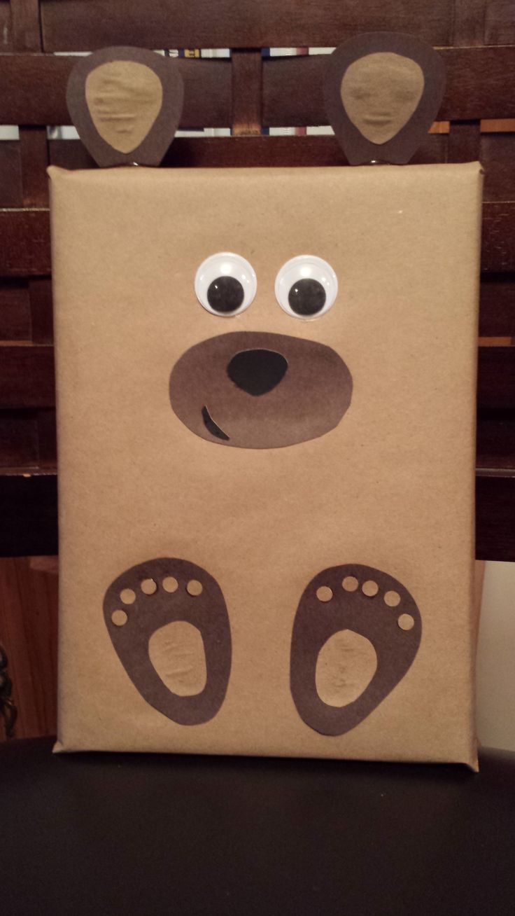 a brown paper bag with a bear face on it