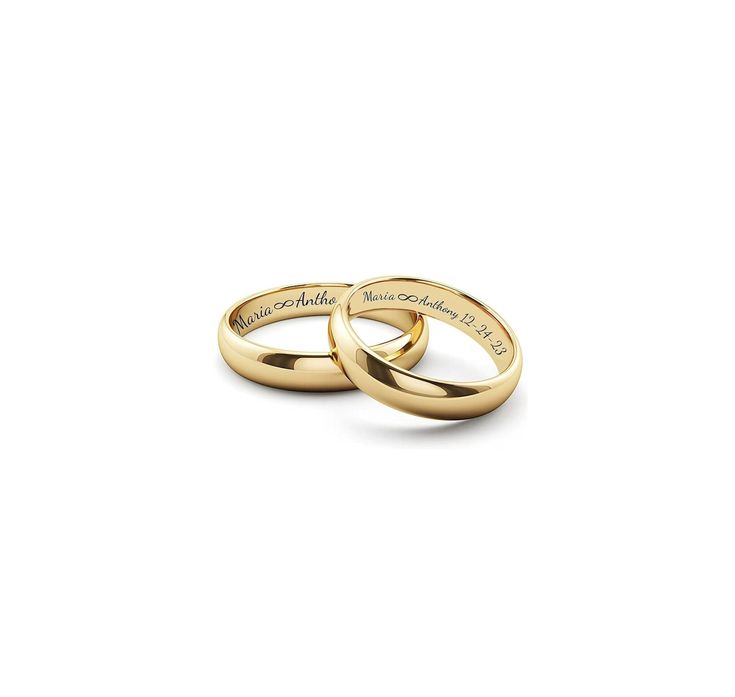 two gold wedding rings with names engraved on the sides, set against a white background