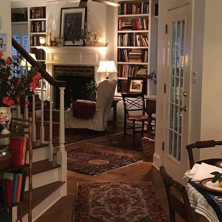 a living room filled with furniture and a fire place