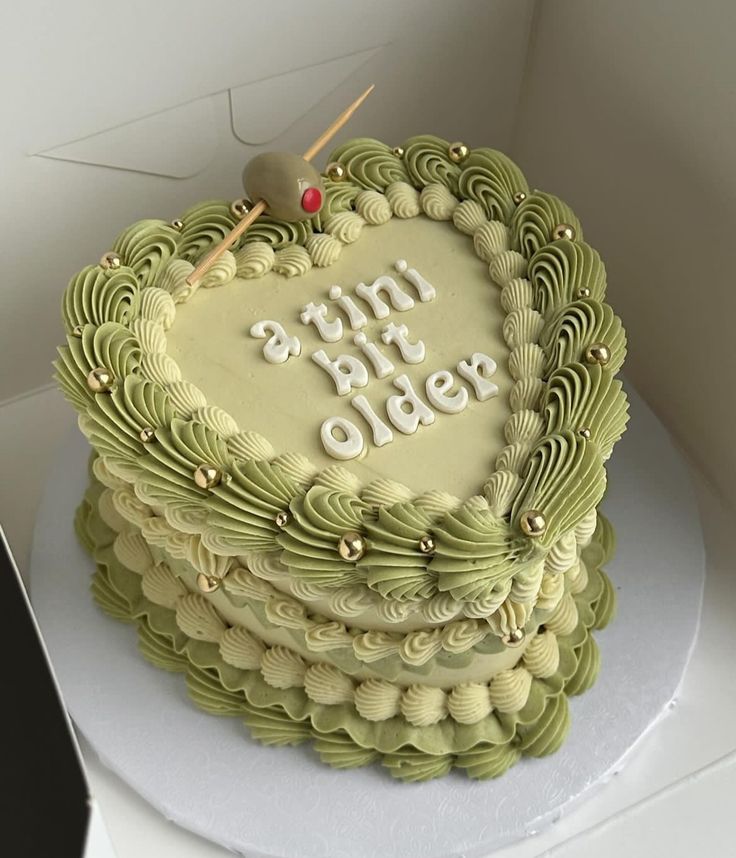 a heart shaped cake with the words happy birthday on it