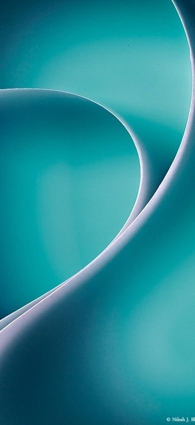 an abstract photo of blue and white curves