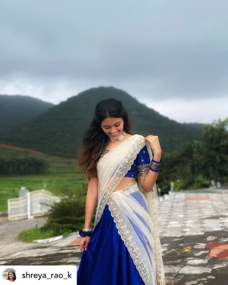 Poses In Langa Voni, Traditional Half Saree Ideas, Langa Voni Aesthetic, Langa Voni Half Saree Simple, Langa Voni Poses, Half Saree Poses Aesthetic, Dark Blue Half Saree, Half Sarees Simple, Simple Langa Voni