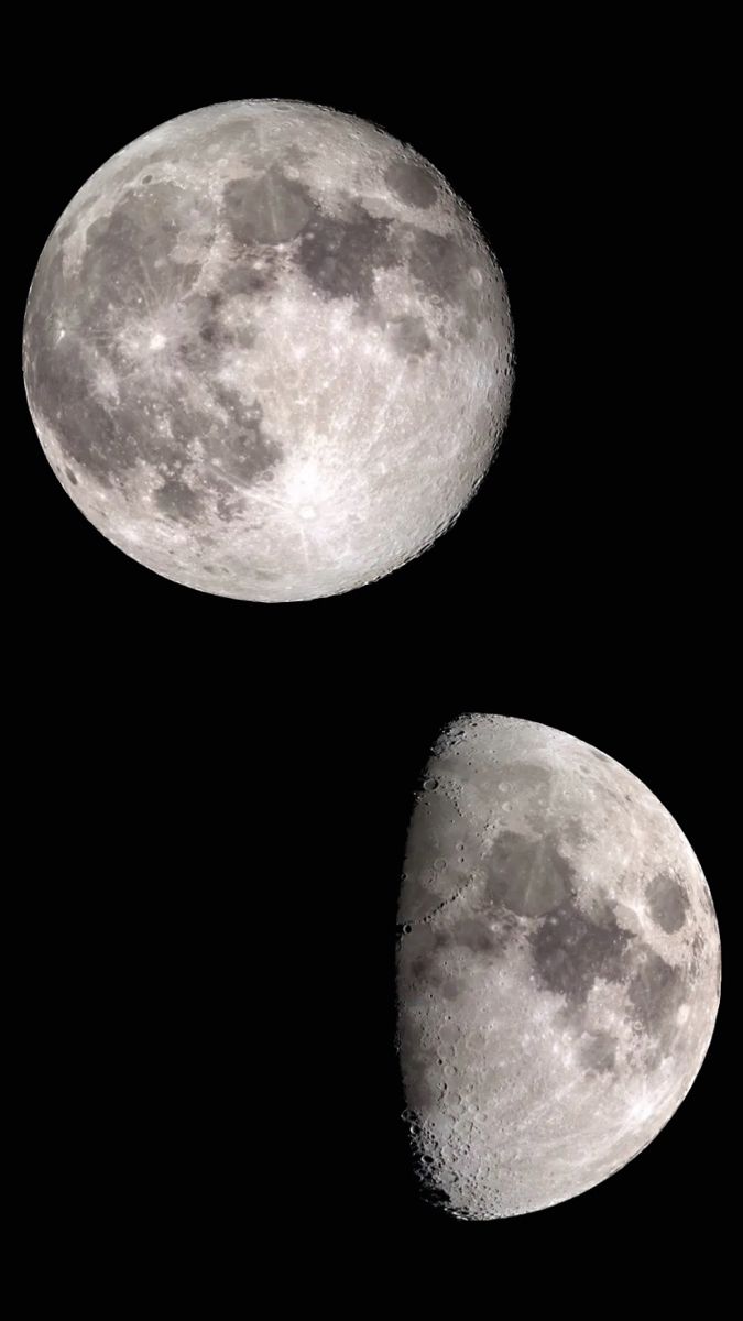 two large moon's side by side in the dark sky