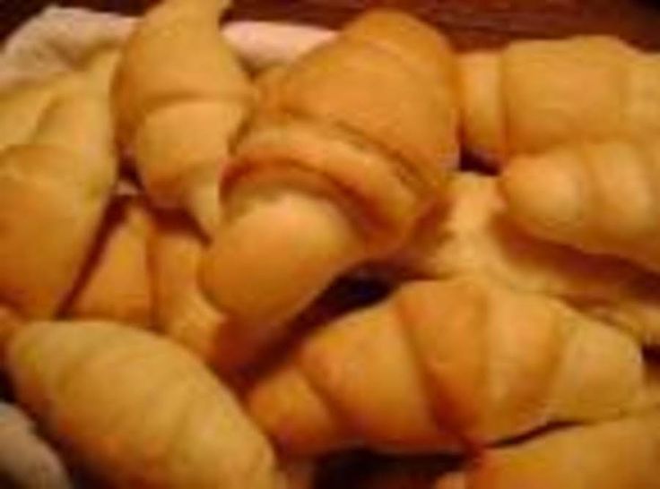 some croissants are piled up together