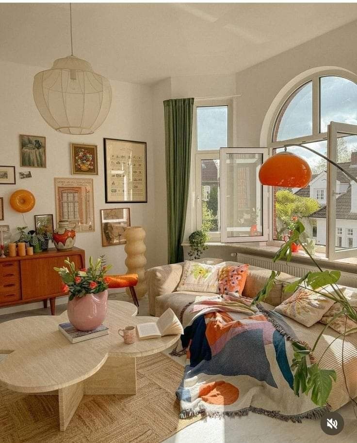 a living room filled with furniture and lots of windows