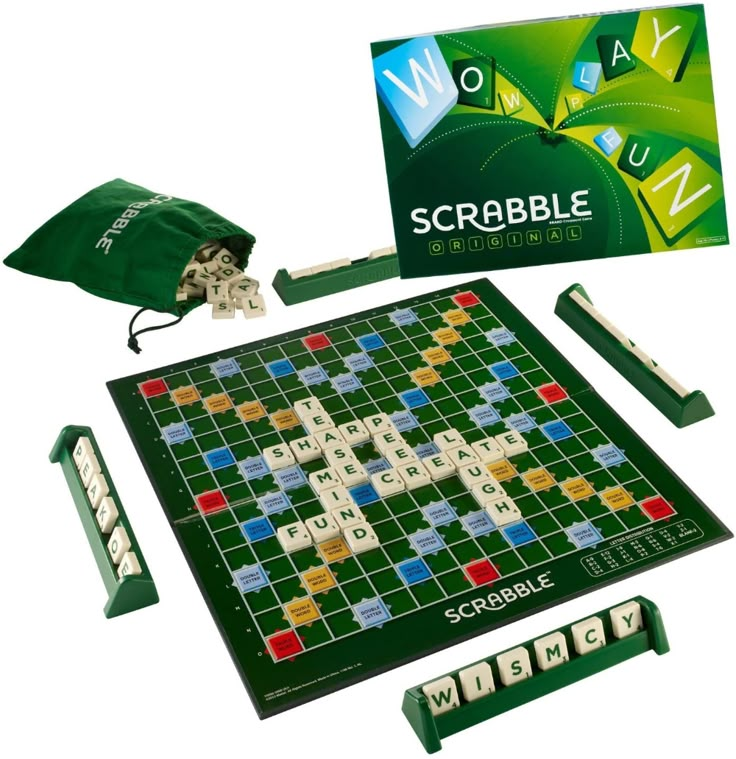 the scrabble board game is set up with its contents and accessories including an umbrella