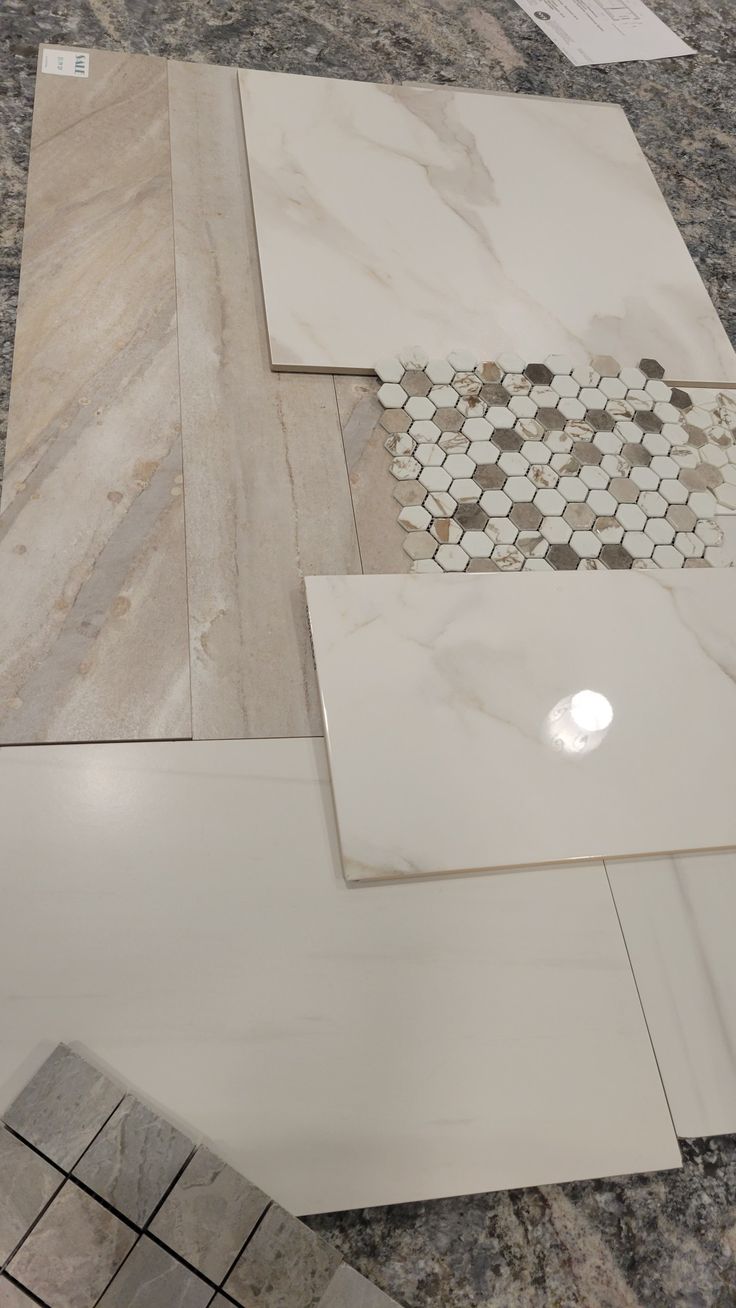 marble tiles are laid out on the floor in preparation to be polished and installed into the wall