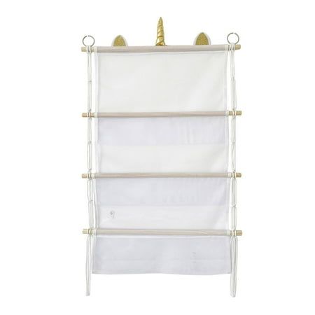 a white wall mounted shelf with three shelves and two gold unicorns on the top