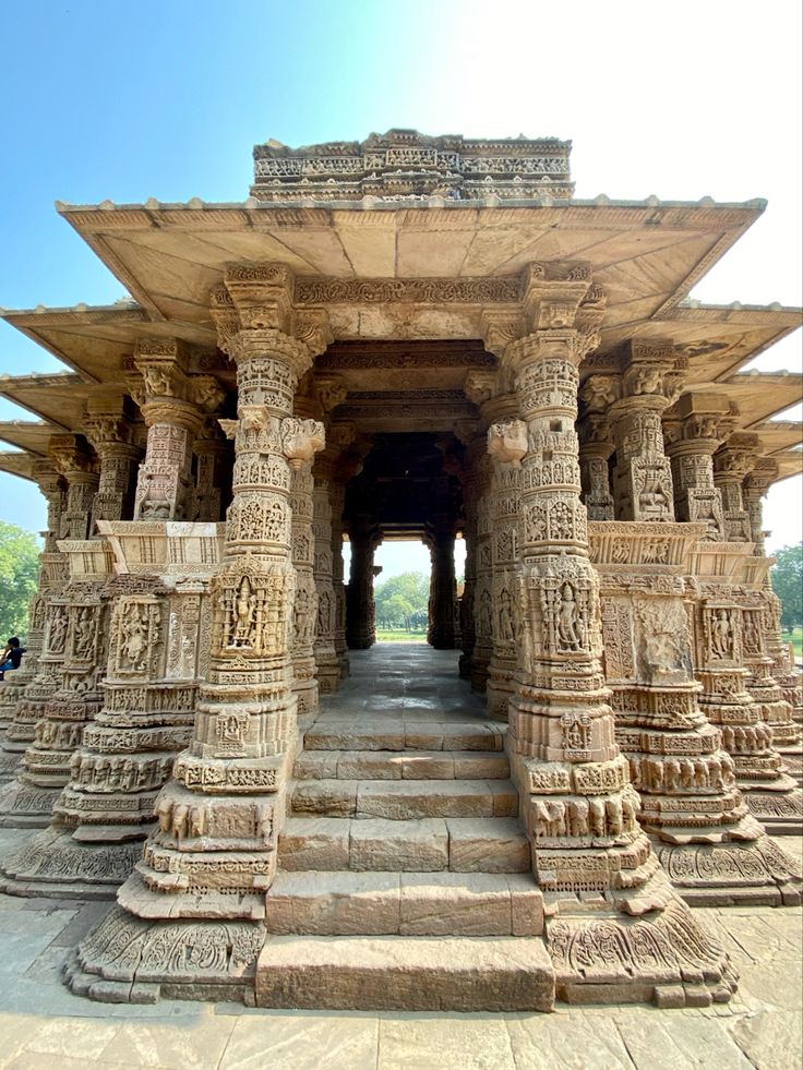 an intricately carved stone structure with steps leading up to it