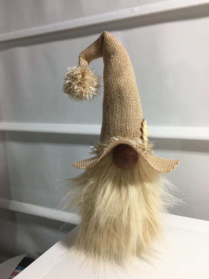 a gnome's hat on top of a white table