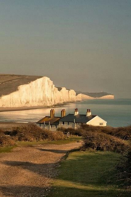 white cliffs line the shore of a beach