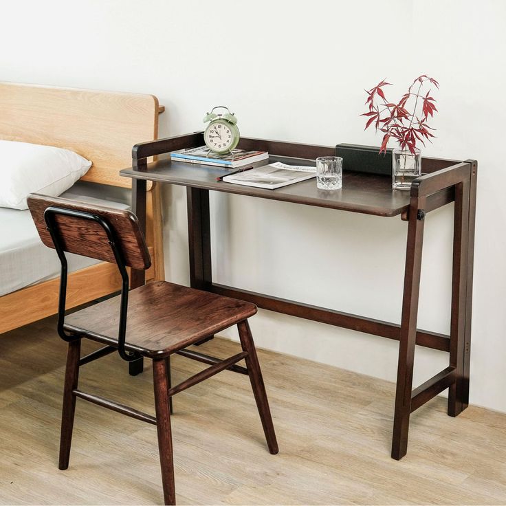 a wooden desk with a chair next to it