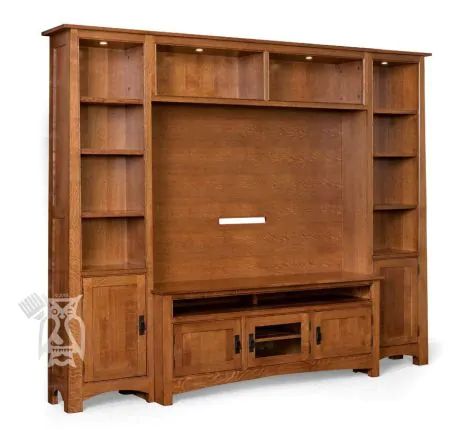 a wooden entertainment center with shelves and drawers