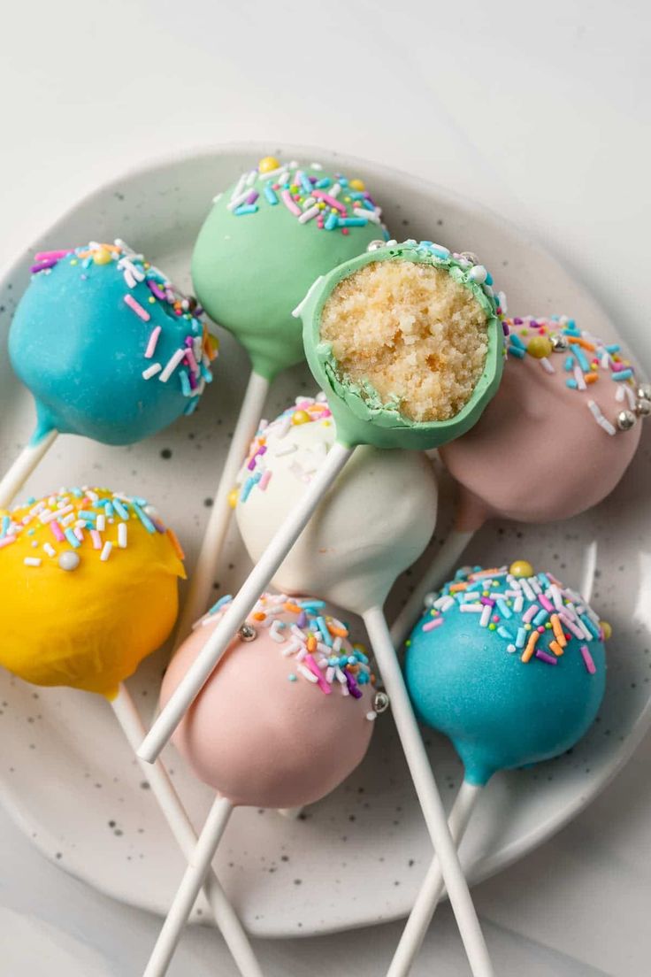 cake pops with sprinkles on a plate