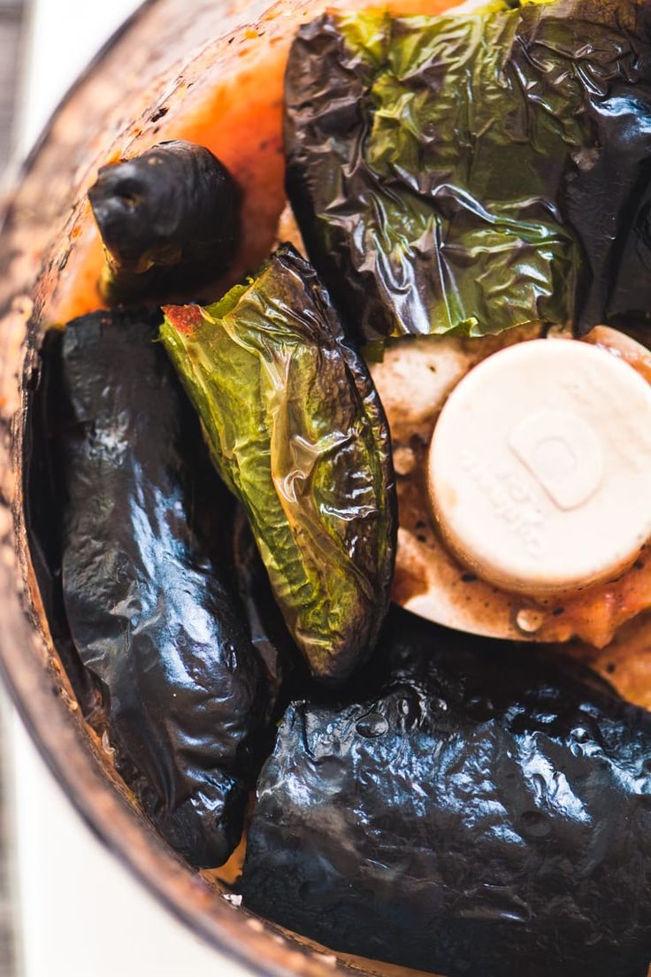 an overhead view of some vegetables in a food processor