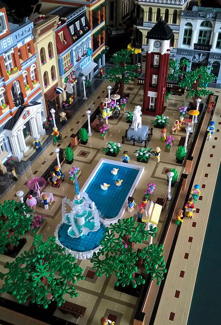 a lego model of a city with buildings and fountains