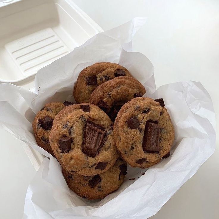 chocolate chip cookies in a white paper bag