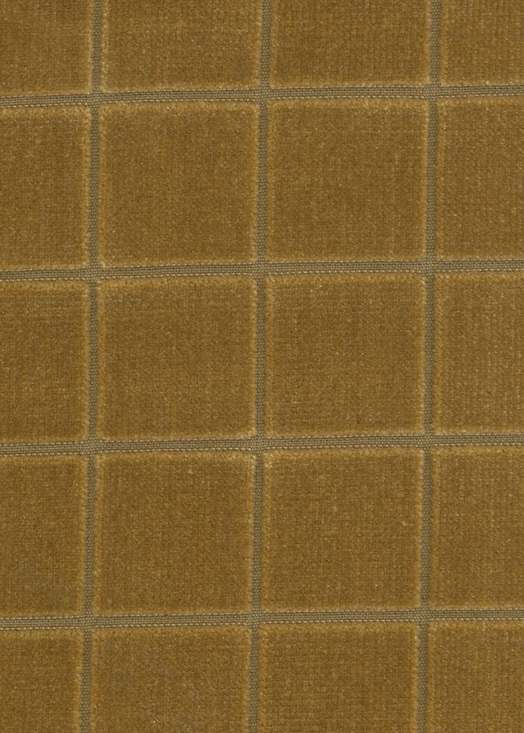 a brown and tan checkered fabric textured with small squares on the top right side