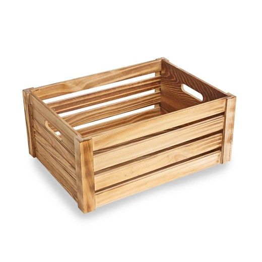 a wooden crate sitting on top of a white surface