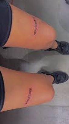 two women's legs with small tattoos on them