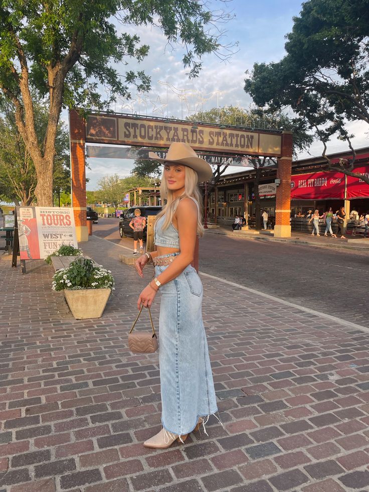 Long Jean Skirt Western Outfit, Big Valley Jamboree Outfits, Jumpsuit Cowboy Boots, Long Denim Skirt Outfit Cowboy Boots, Denim Rodeo Outfit, Denim On Denim Festival Outfit, Western Coastal Outfits, Denim Outfit Cowgirl, Coastal Cowgirl Outfit Aesthetic