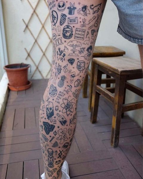 a person with many tattoos on their legs