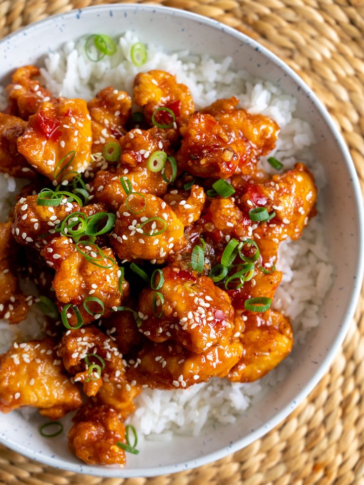 a white bowl filled with chicken and rice