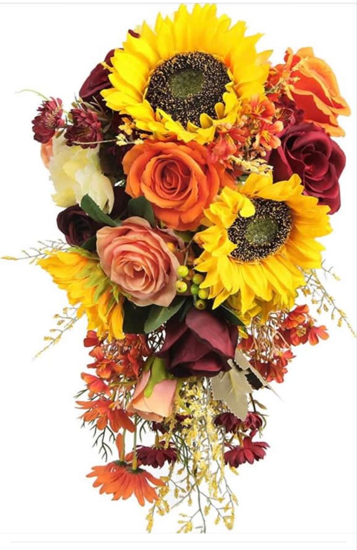 a bouquet of sunflowers, roses and other flowers is shown in this image