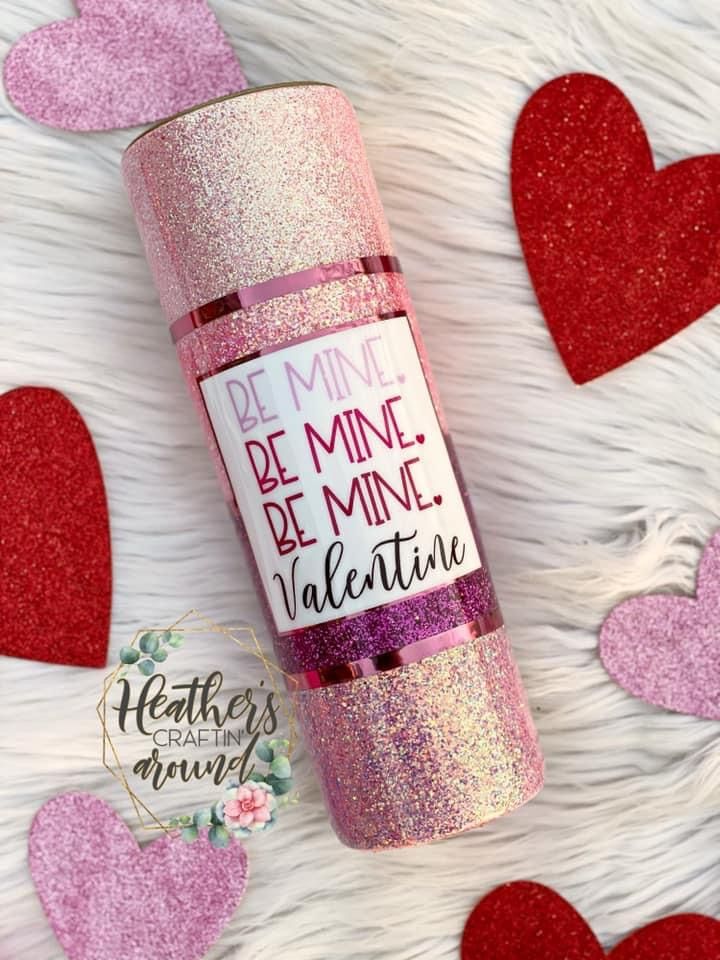 valentine's day glitter lip balm bottle with hearts around it and the words be mine