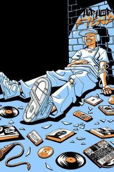 a man laying on top of a bed surrounded by records and other electronic equipment in front of a brick wall