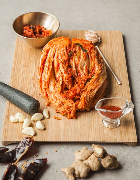 the food is prepared and ready to be eaten on the cutting board with other ingredients