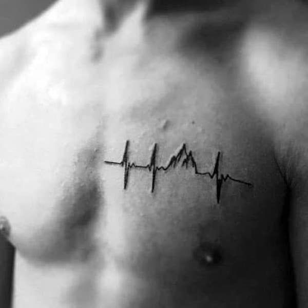 a man with a heartbeat tattoo on his chest