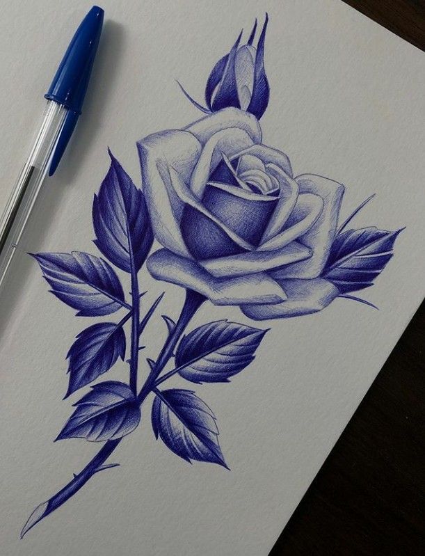 a drawing of a blue rose with leaves on it and a pen next to it