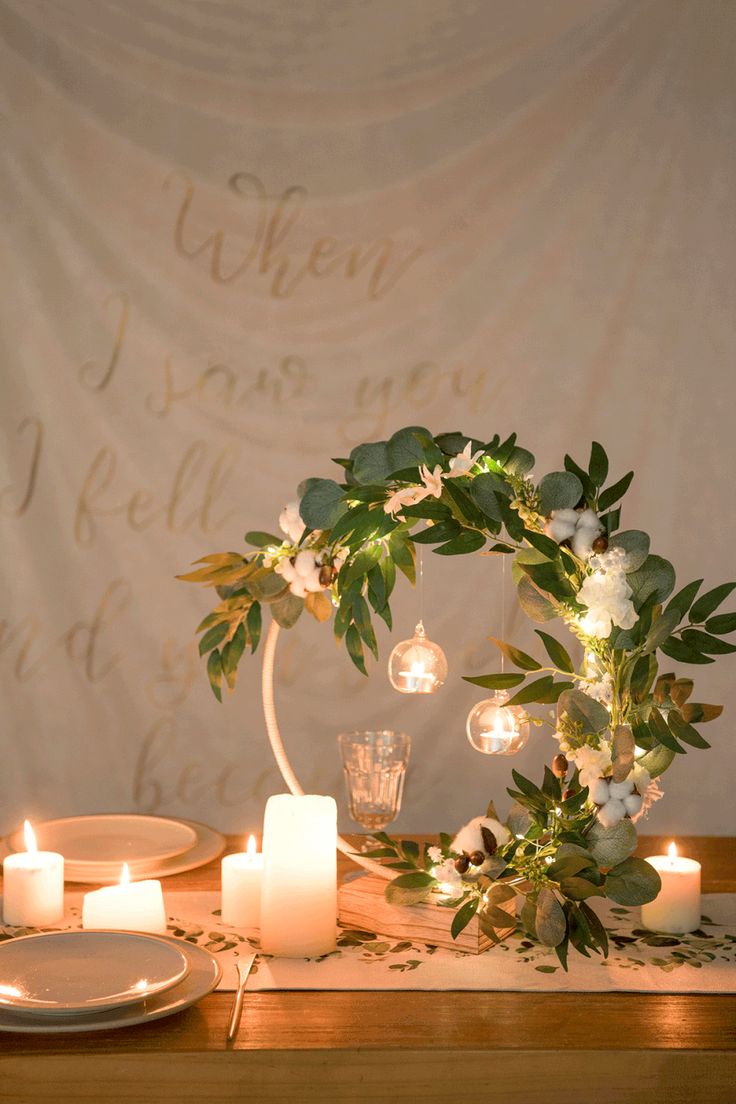 a table with candles and flowers on it