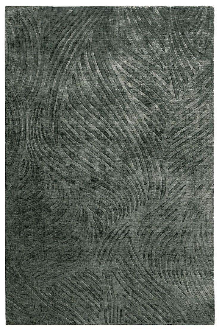 an area rug with wavy lines in grey and black colors on a white background,