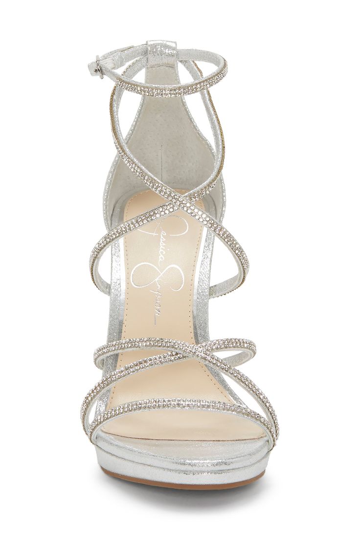 Tiny faceted stones twinkle amid the slender straps that wrap their way up this party-ready sandal set upon a minimal platform. 4" heel Adjustable ankle strap with buckle closure Textile upper/synthetic lining/leather sole Imported Women's Shoes Hoco Accessories, Quince Heels, Hoco Heels, Hoco Shoes, Silver Heels Prom, Prom Shoes Silver, Quinceanera Shoes, Shoes Heels Prom, Homecoming Shoes