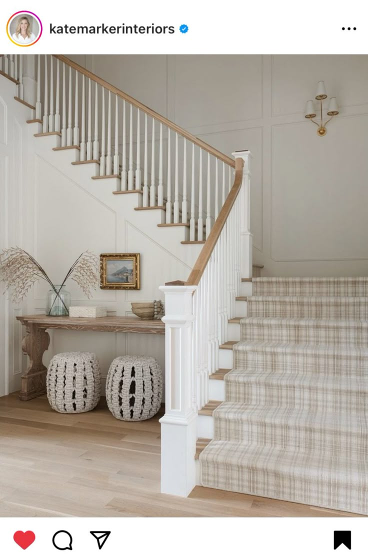 the stairs in this house have been painted white and are decorated with black and white accents