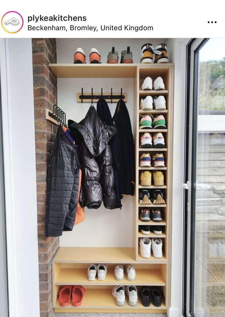 an organized closet with shoes and coats