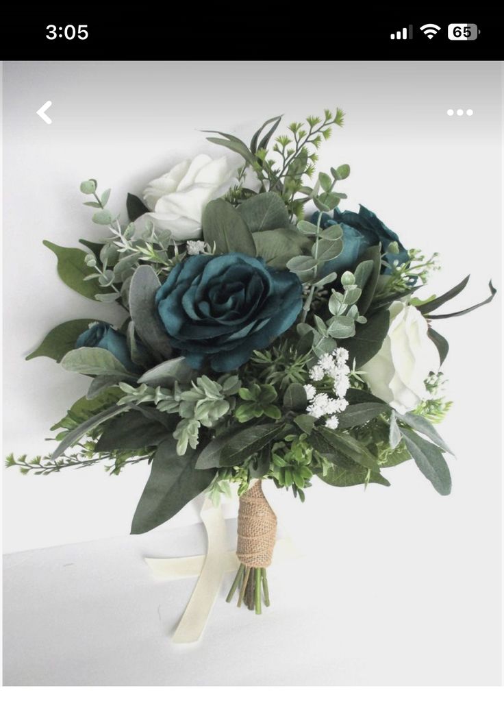 a bridal bouquet with white and blue flowers