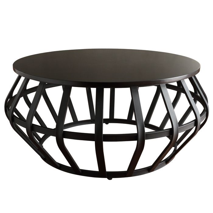 a round table with black wood and metal design on the top, against a white background