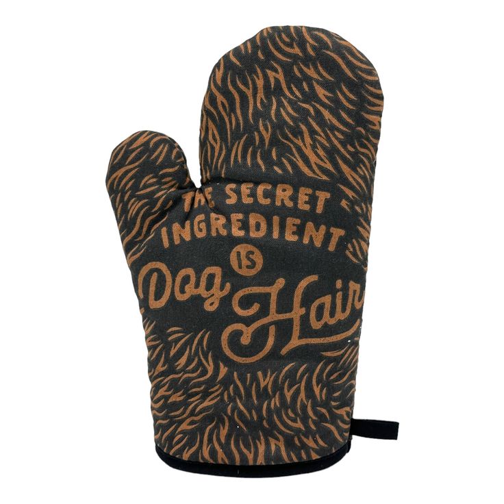 an oven mitt that says the secret ingredient dog hair on it's palm